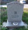 WC10 - Honed Light Grey Ogee style Headstone, with Outlined Teddy Bear design.