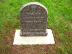 WCY4 – 2’3” Honed Indian Dakota Half Round style Headstone and pitched edges and base, with an Outlined Cross design.