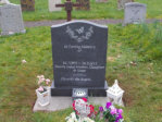 WCY5 – 2’6” Honed Dark Grey Ogee style Headstone with Outlined flowers and Butterfly design.
