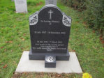 WCY3 - 2'6" Honed Dark Grey Oval Top with Ogee Shoulders style Headstone, with Panel Rose design and Outlined Cross design.