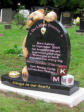 WC1 - All polished Dark Grey Half Round with curved sides style Headstone, with large Teddy Bear holding chain over stone