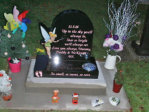 WC7 - All Polished Black Half Round style Headstone , with Full Color Tinkerbell design (included in shape of stone) and Coloured Footprint design.